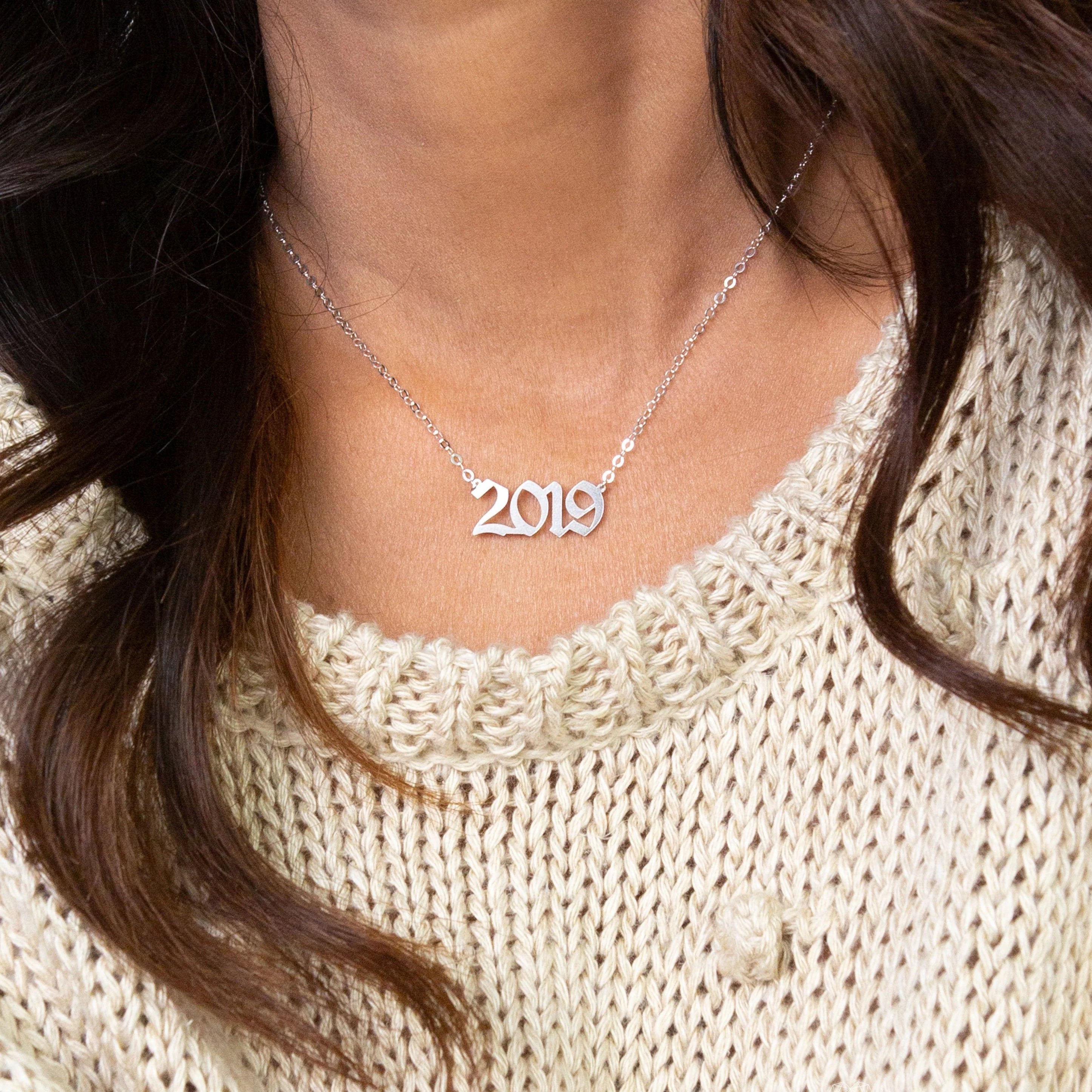 Necklace with year pendant